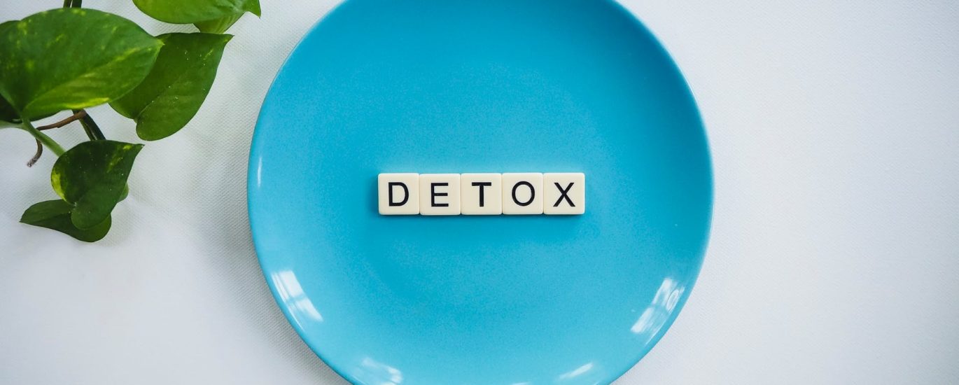 detox text on round blue plate